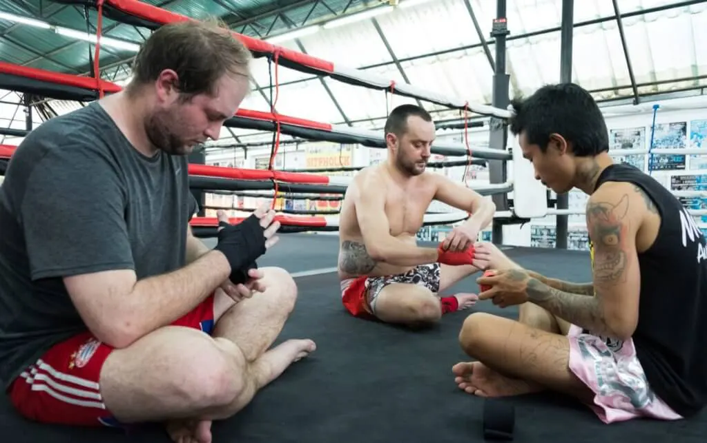 Wrapping hands preparing to train in Muay Thai