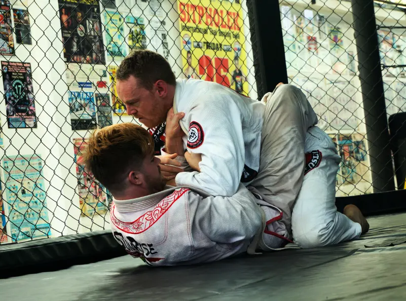 Chris training in BJJ with a classmate