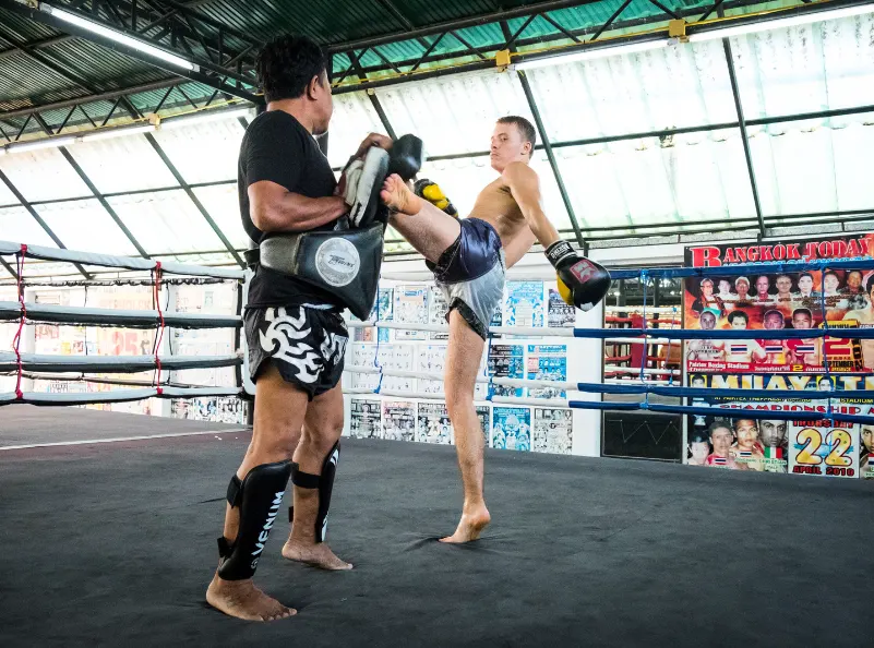 Kicking pads with muay thai trainer