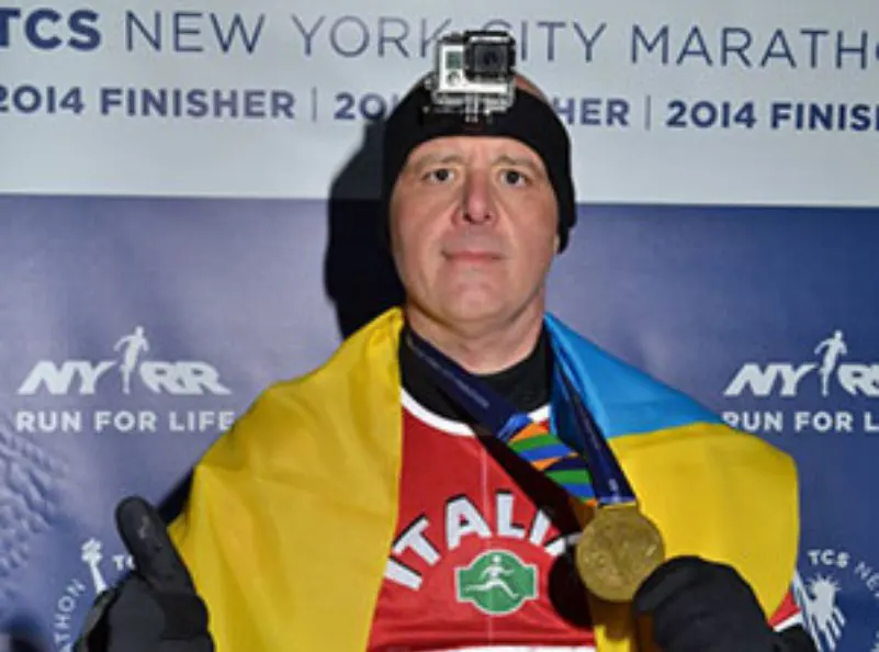 Athos winning the New York marathon after training at Kombat Group