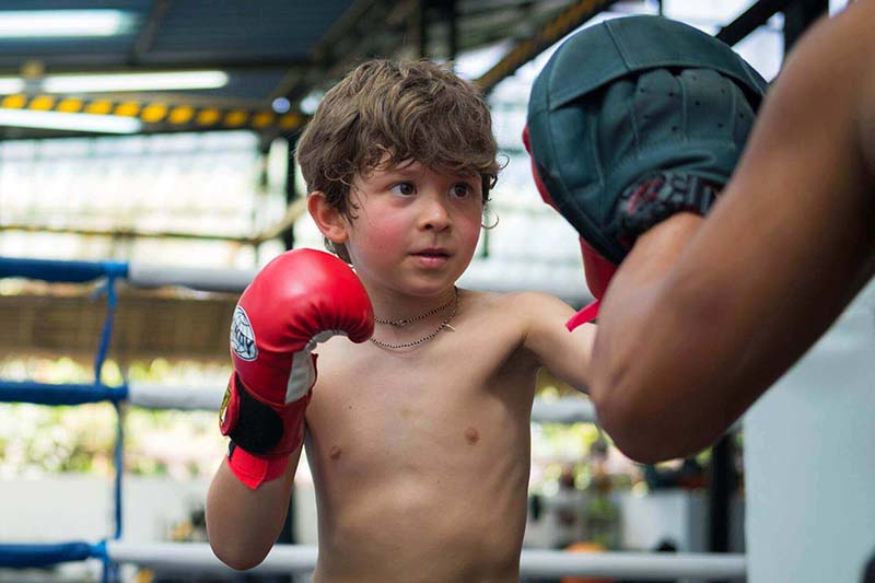 Young Kid Training in Boxing While in Vacation